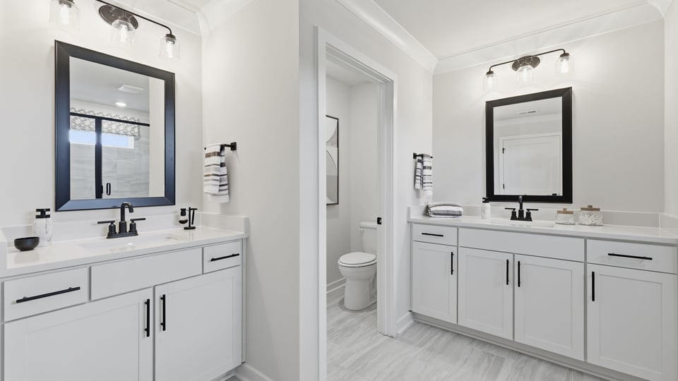 Primary bathroom with double vanity sink.
