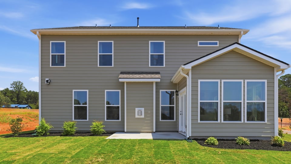 Back exterior with large backyard.