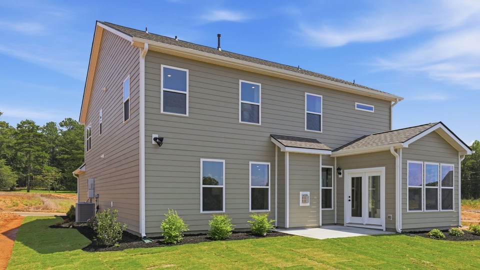 Back exterior with large backyard.