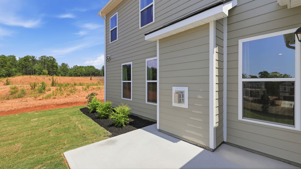 Back exterior with large backyard.