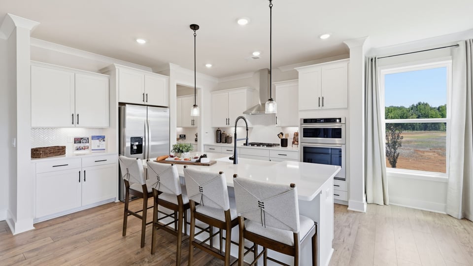 Kitchen with cabinets and island.