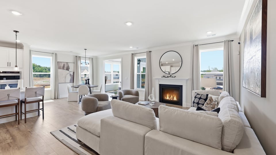 Living room with windows and fireplace.