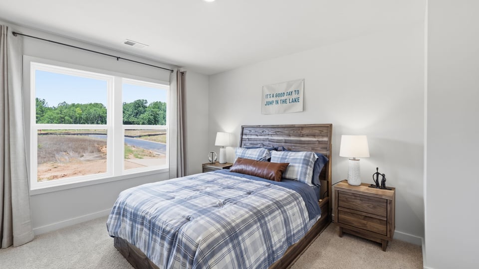 Bedroom with window and closet.
