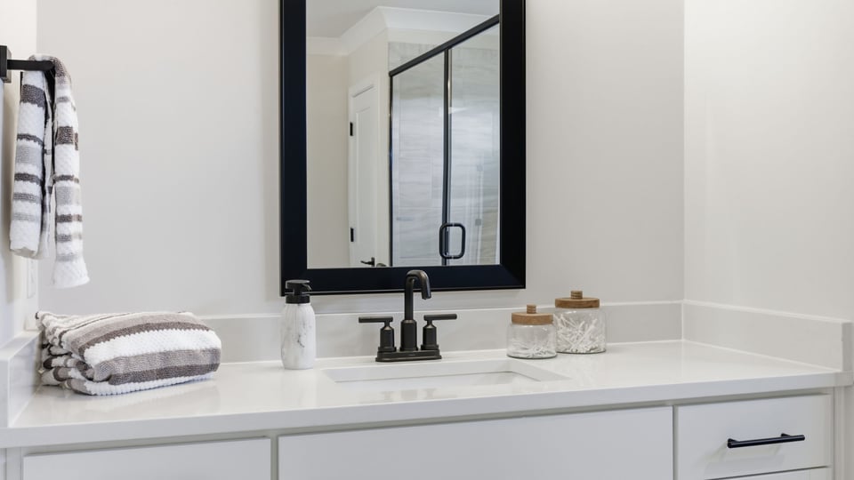 Primary bathroom with double vanity sinks.