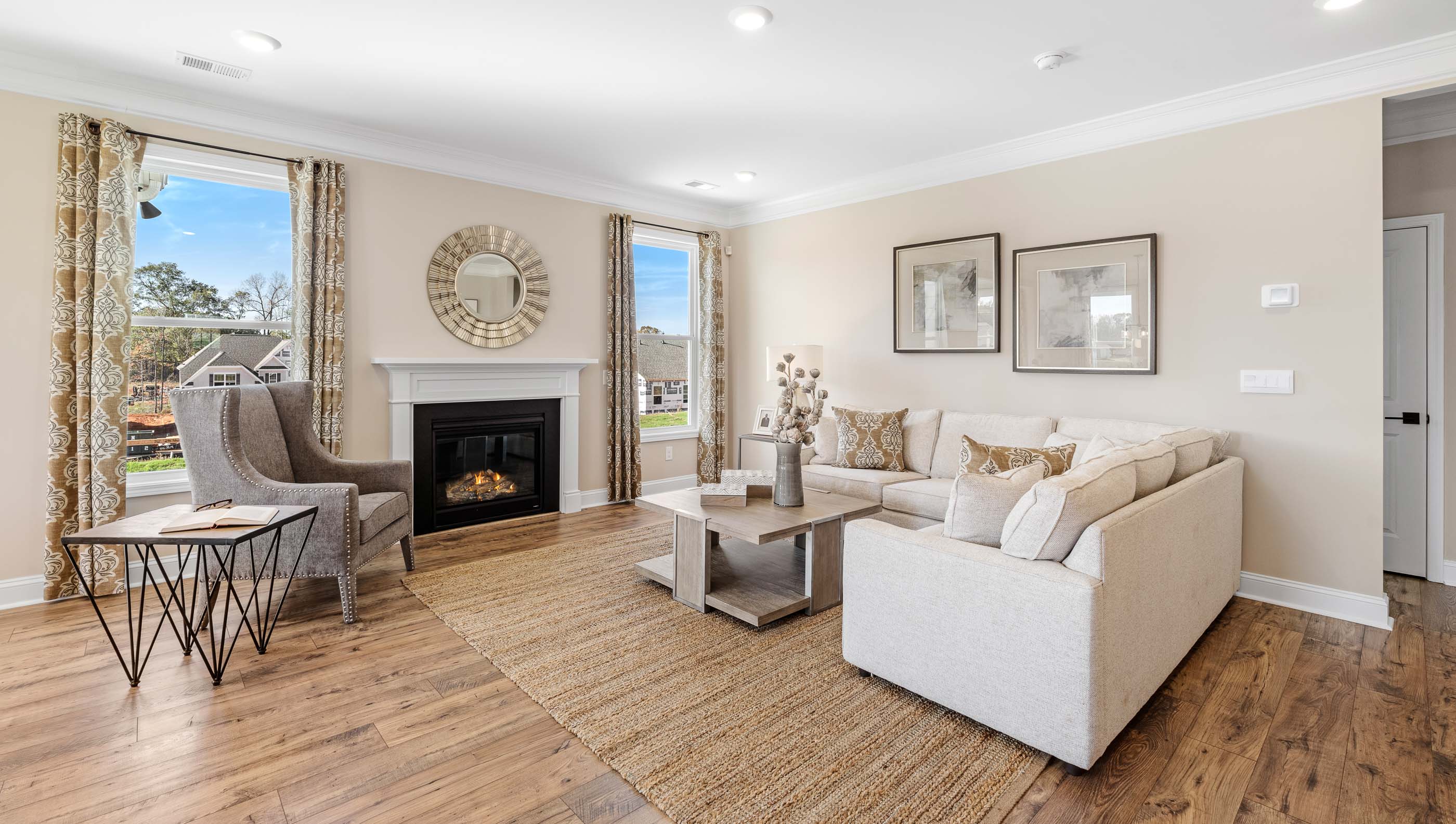 Living room with windows and fireplace.
