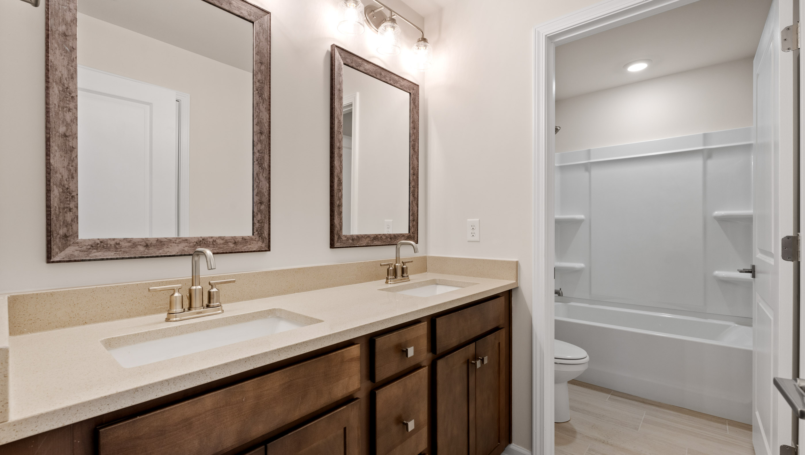Hall bathroom with dual sink vanity.