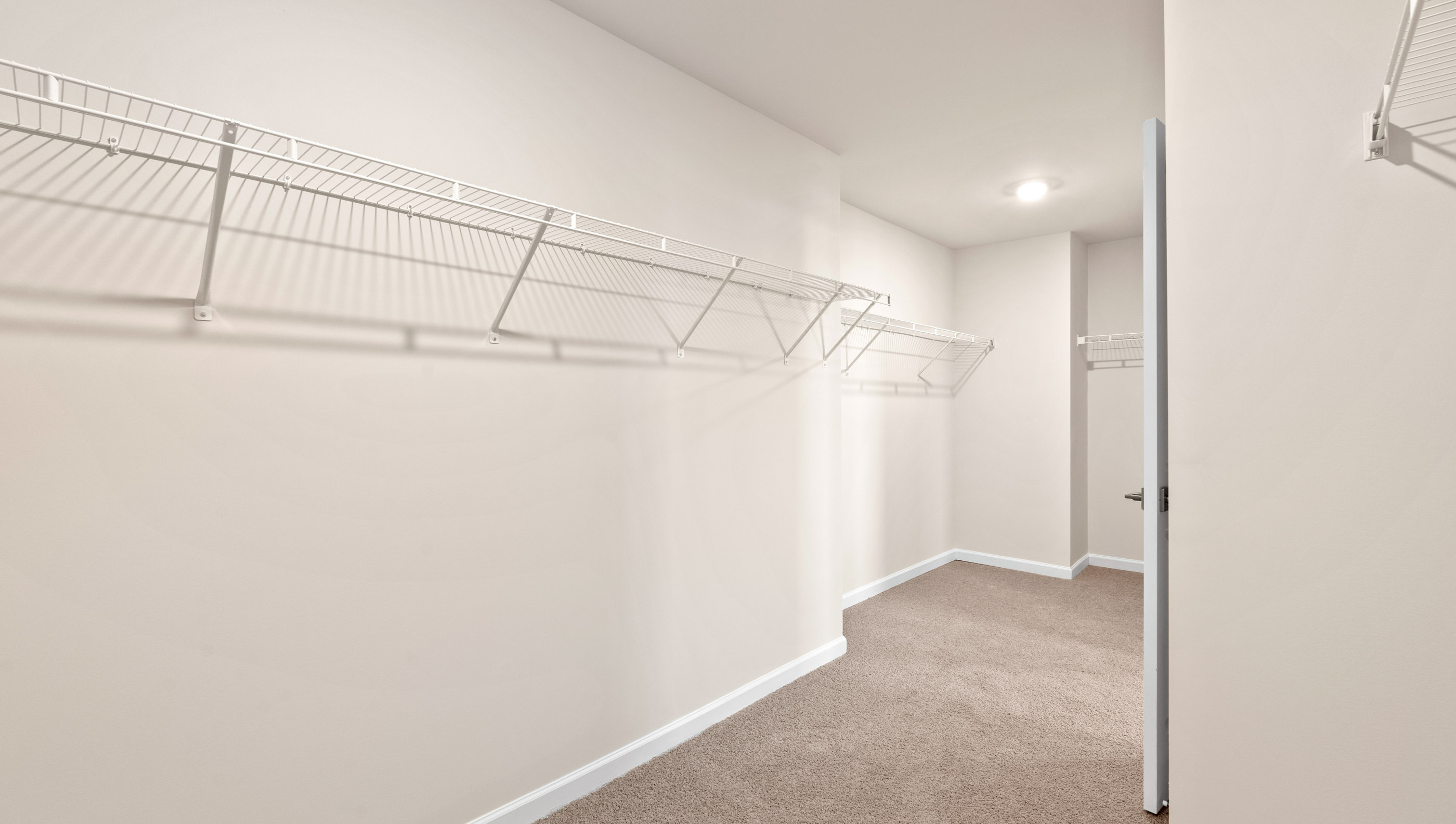 Primary bedroom walk-in closet.