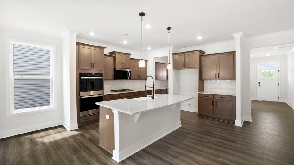 Kitchen with island and cabinets.