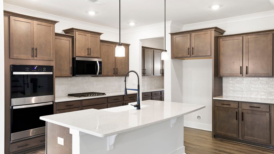 Kitchen with island and cabinets.