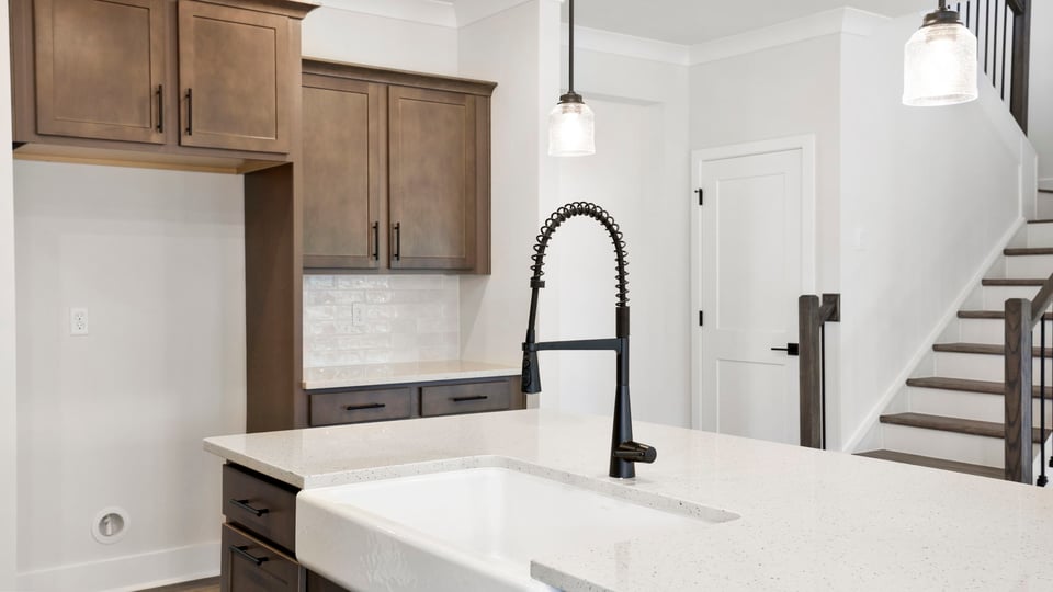 Kitchen with island and cabinets.