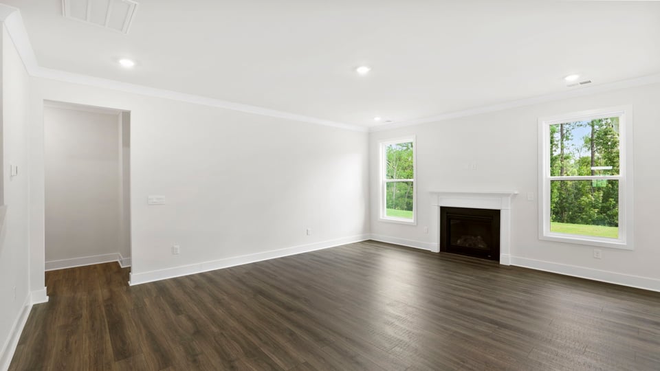 Living area with windows and fireplace.
