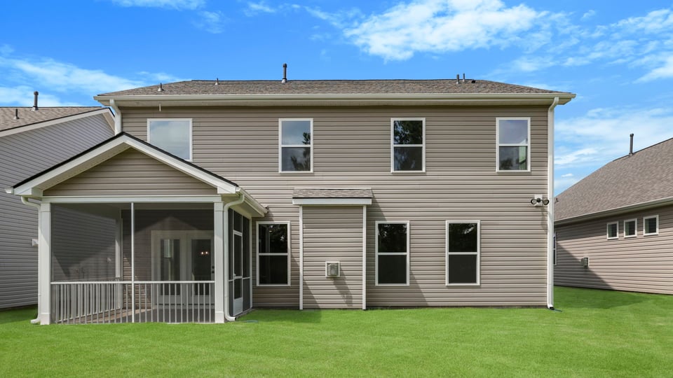 Back exterior with large backyard.
