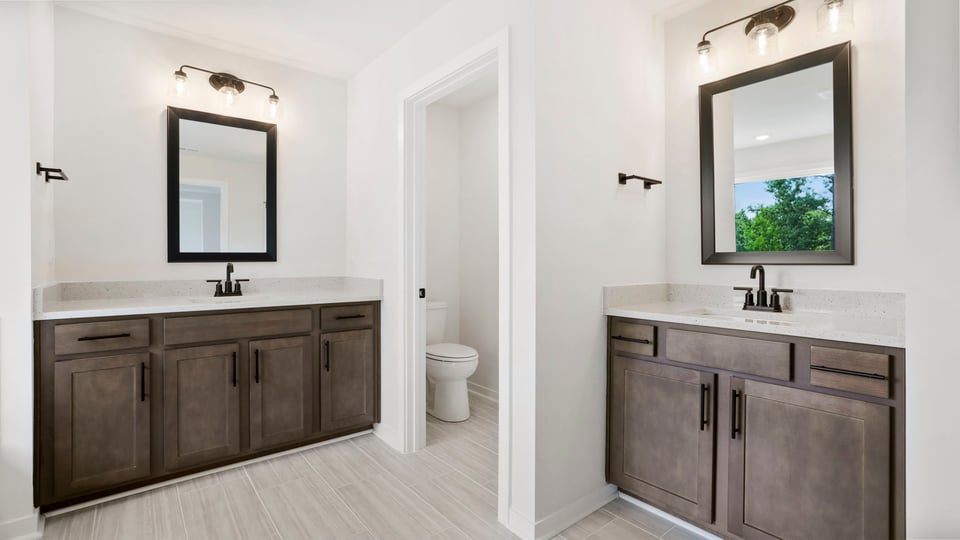 Primary bathroom with vanity sinks.