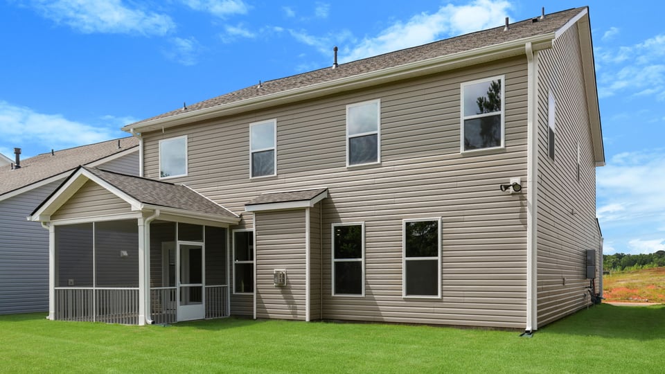 Back exterior with large backyard.