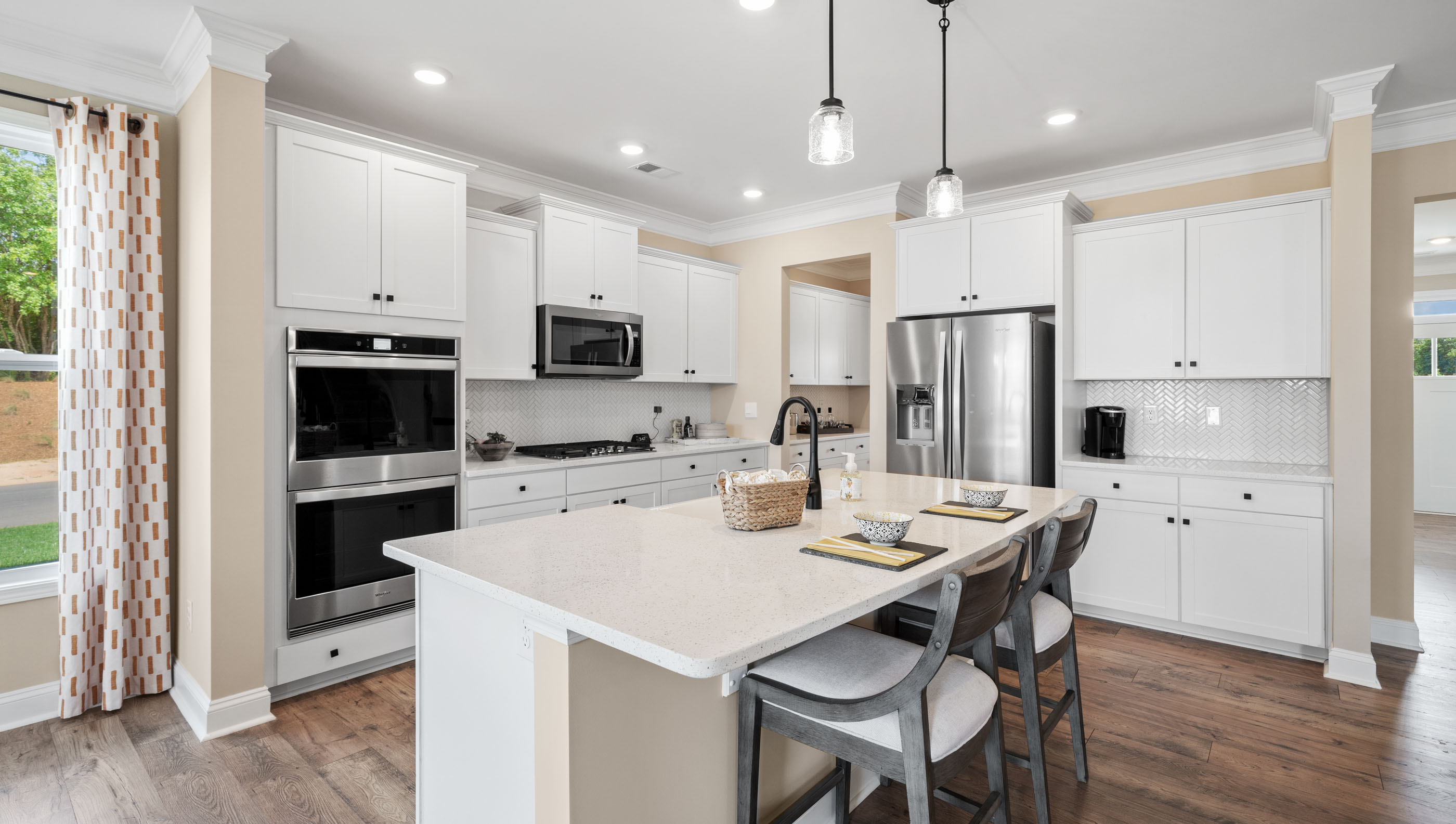 Kitchen and island with granite counter tops.