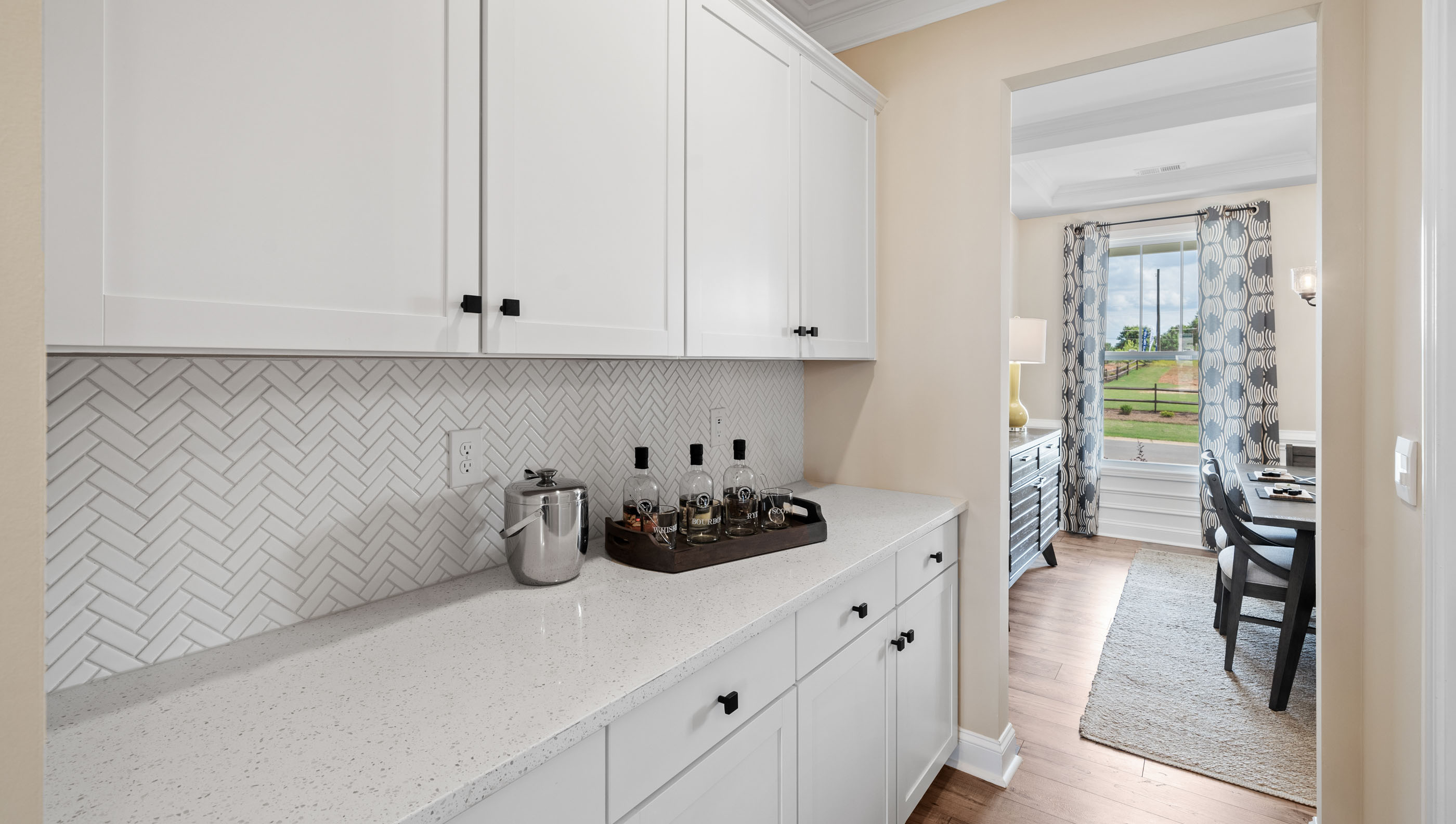 Kitchen with white cabinets and granite counter tops.