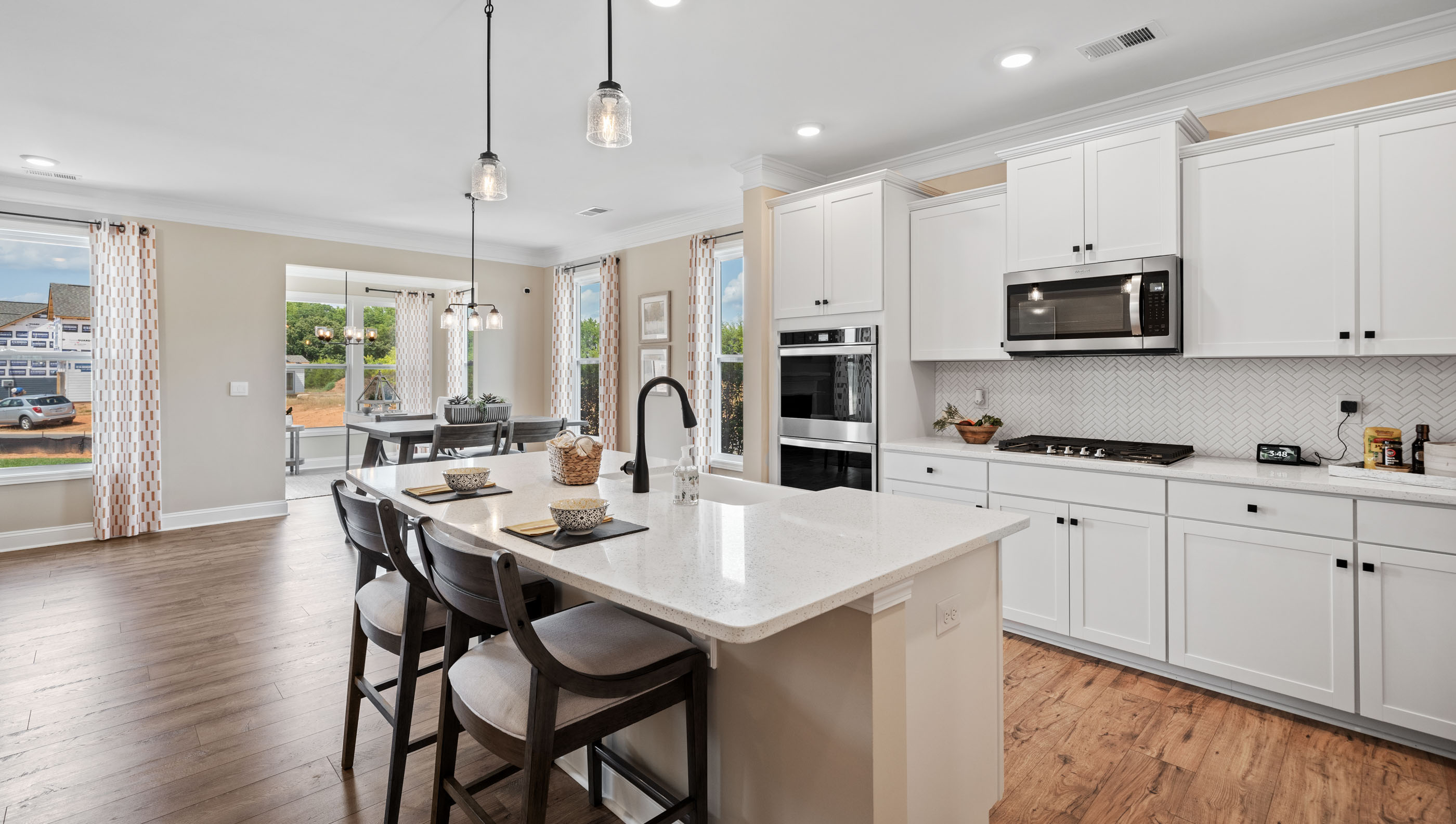 Kitchen and island with granite counter tops.