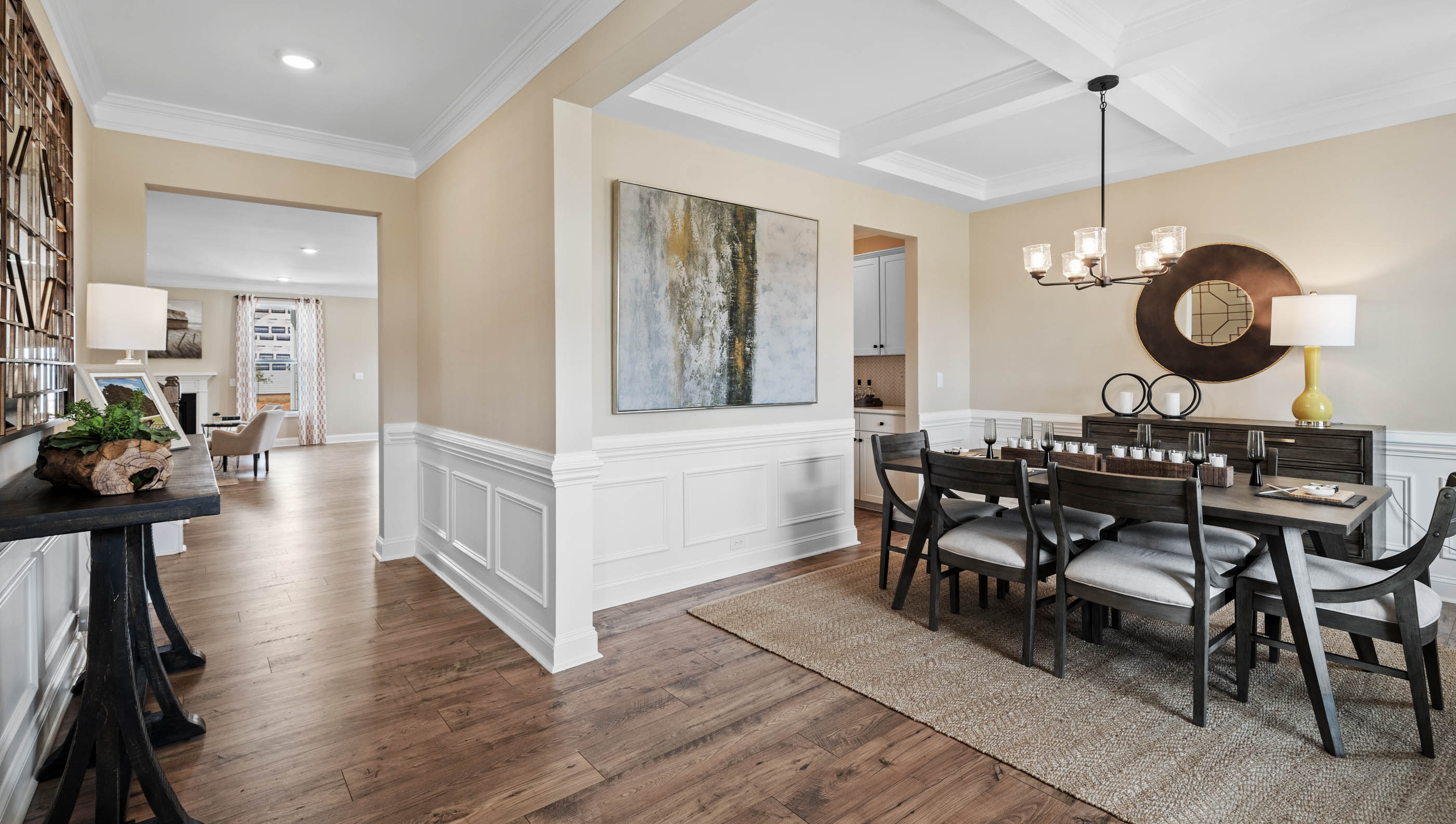 Flex space at front of home with view of hallway.