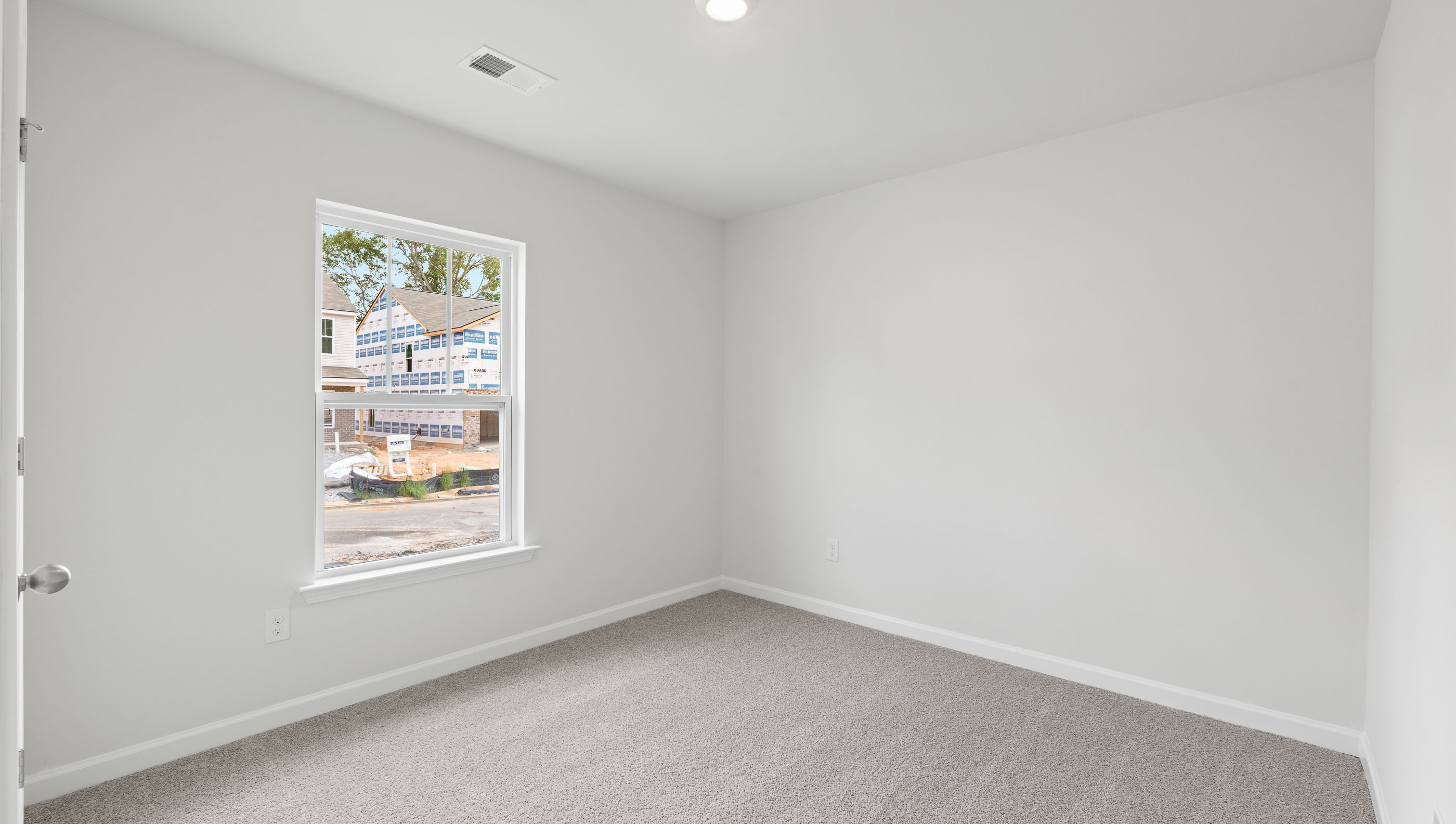 Room with carpet and window.