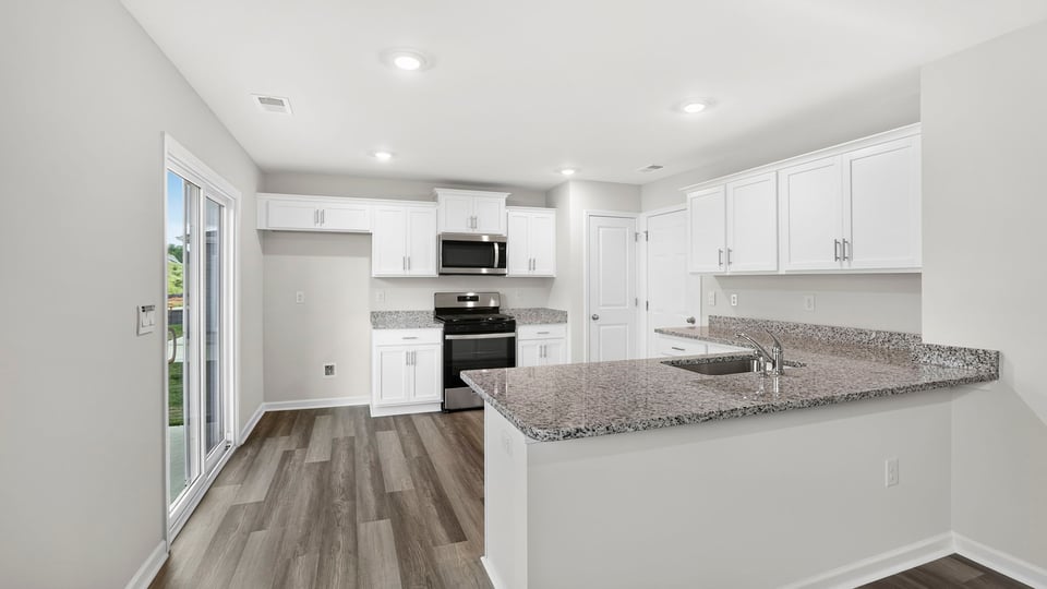 Kitchen with island and countertops.