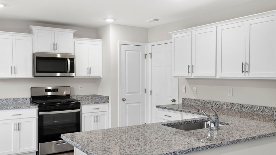 Kitchen with island and countertops.