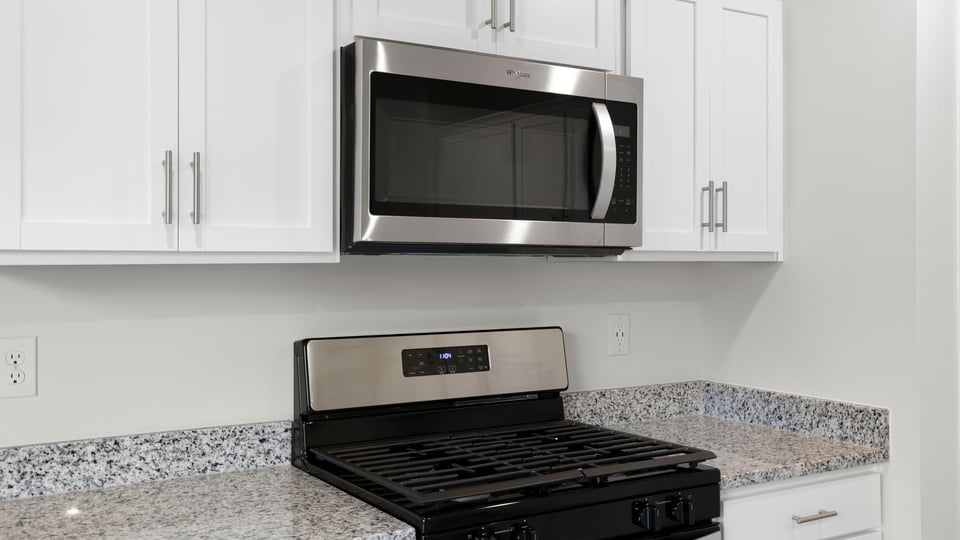 Kitchen with island and countertops.
