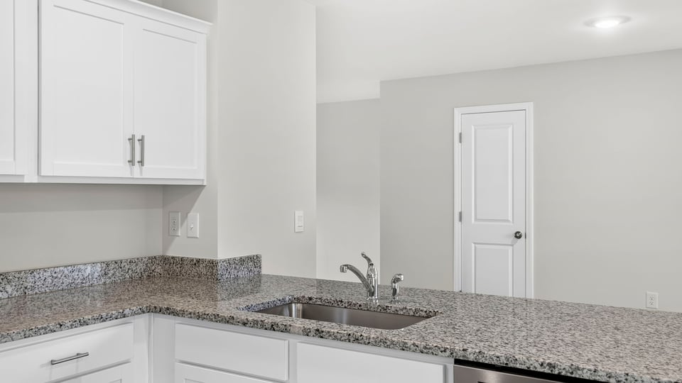 Kitchen with island and countertops.