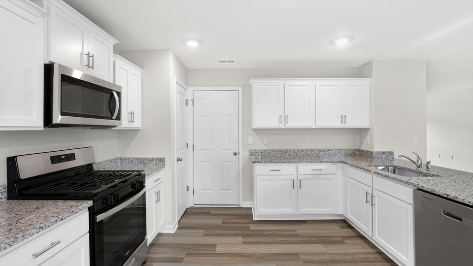 Kitchen with island and countertops.