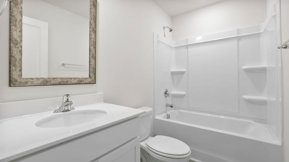 Bathroom with vanity and tub.