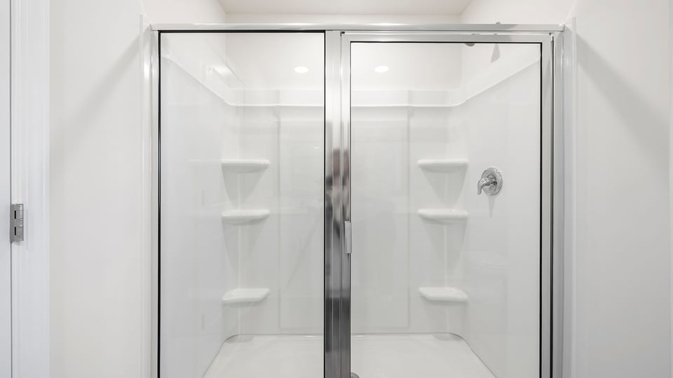 Bathroom with walk in shower.