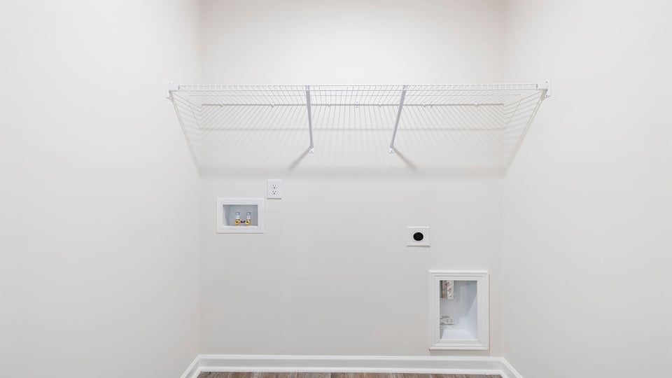 Wak in laundry with shelves.