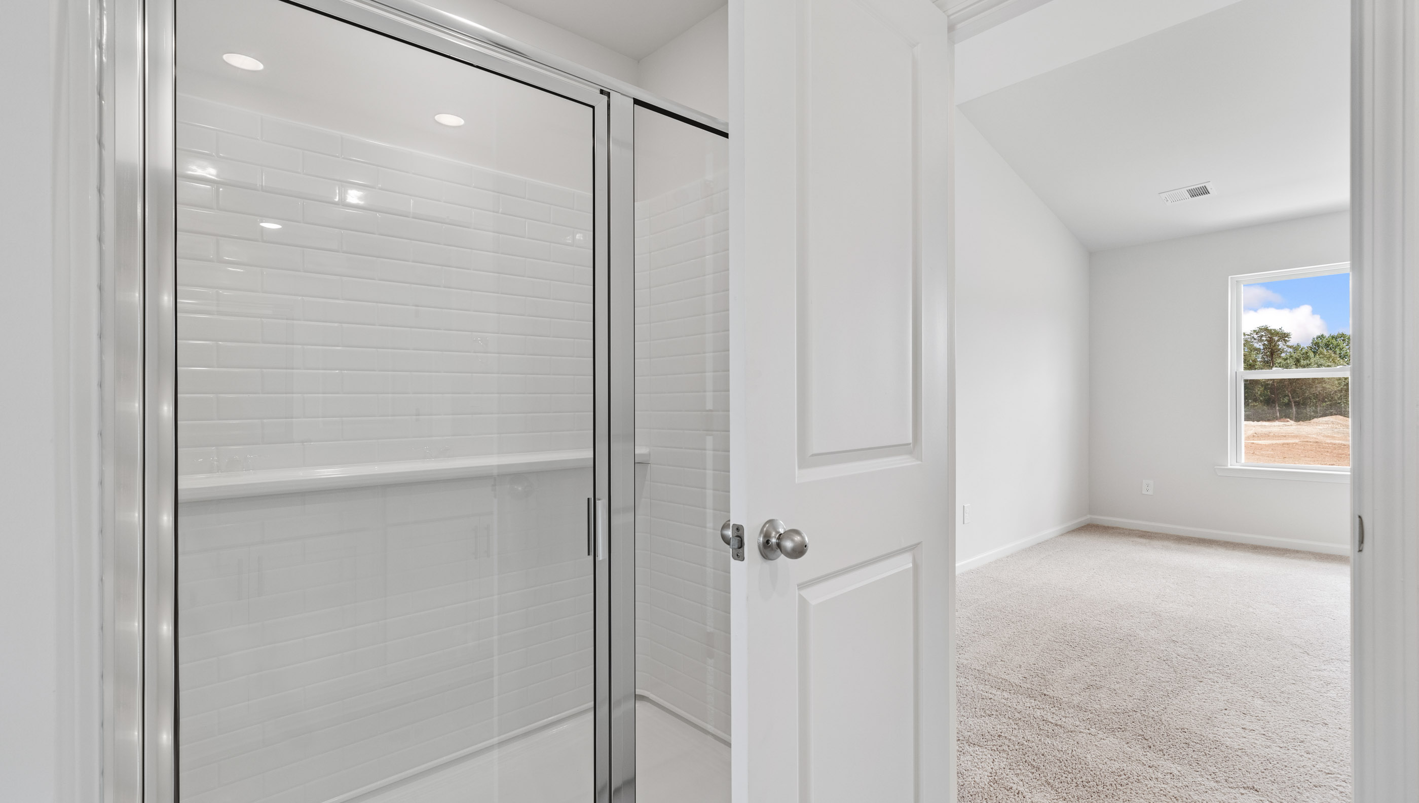 Walk in shower in primary bathroom.