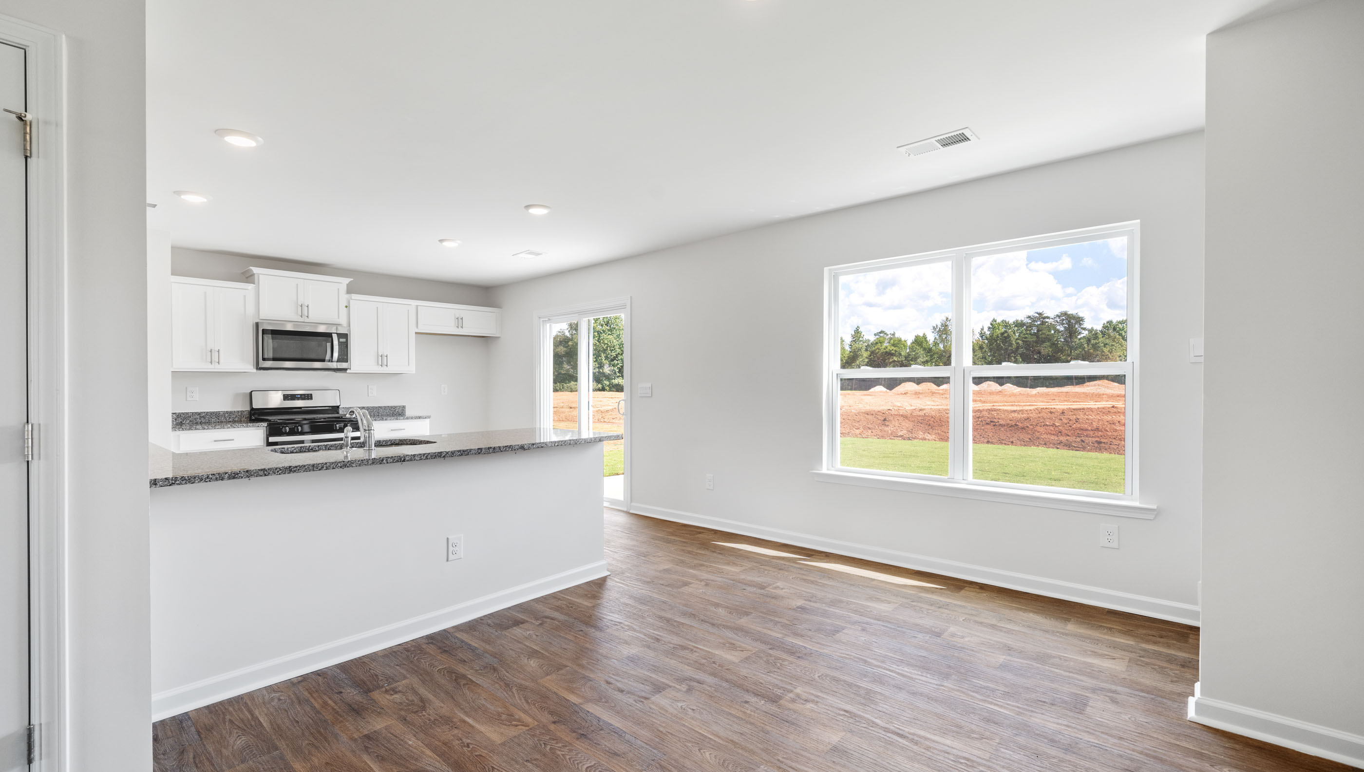 Dining room with kitchen view.