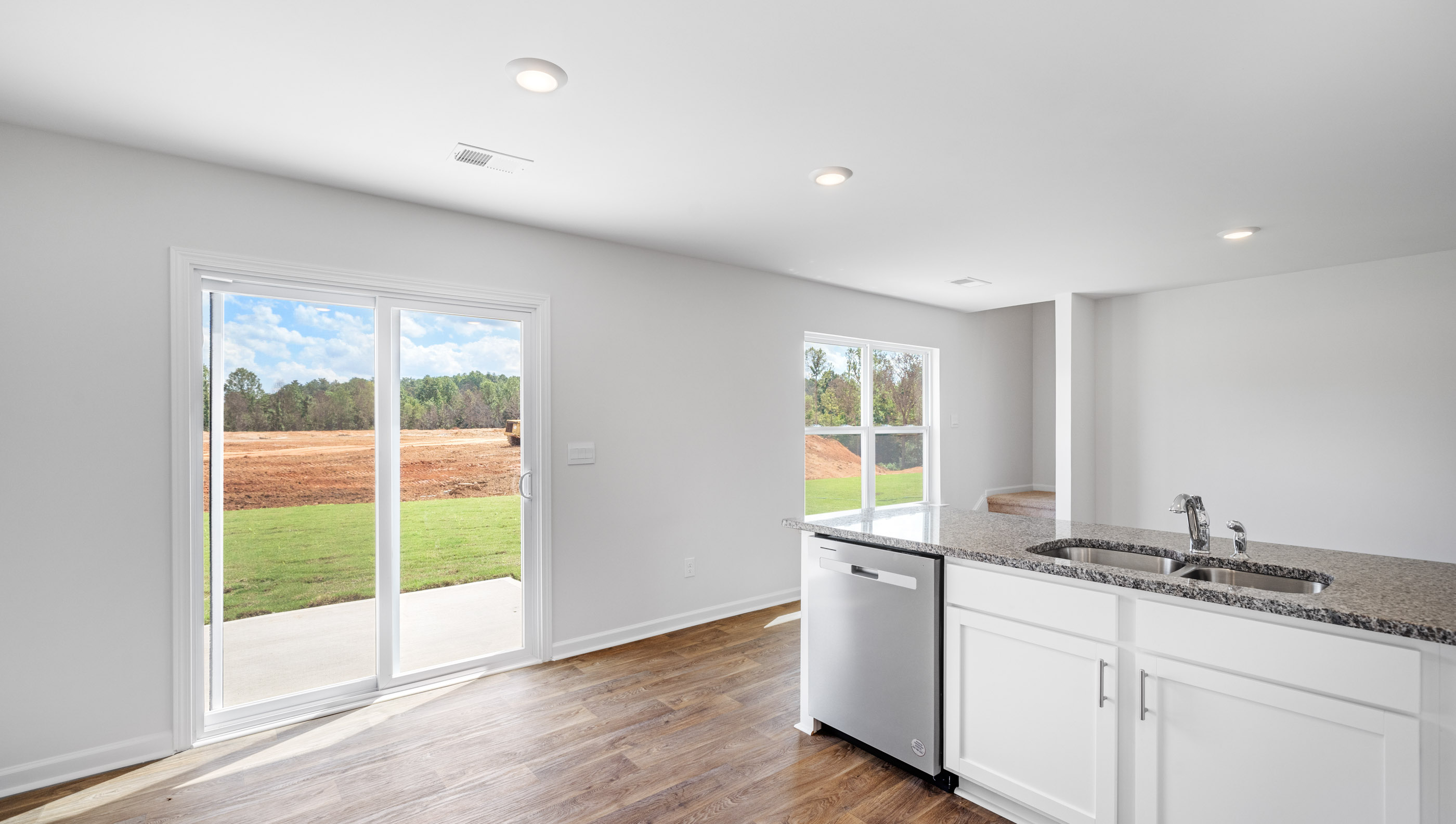 Kitchen and island with granite counter tops.