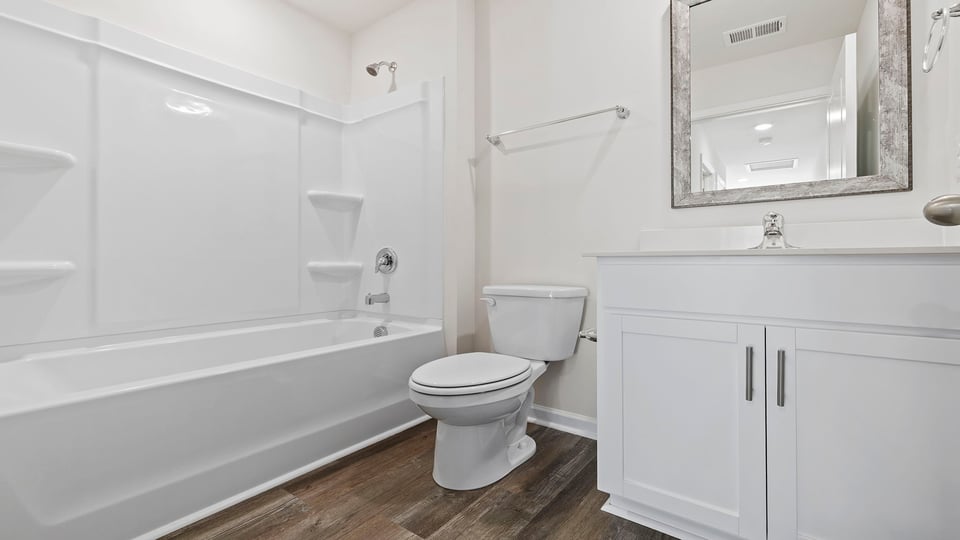 Bathroom with vanity and tub.