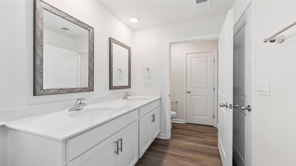 Bathroom with dual vanity.