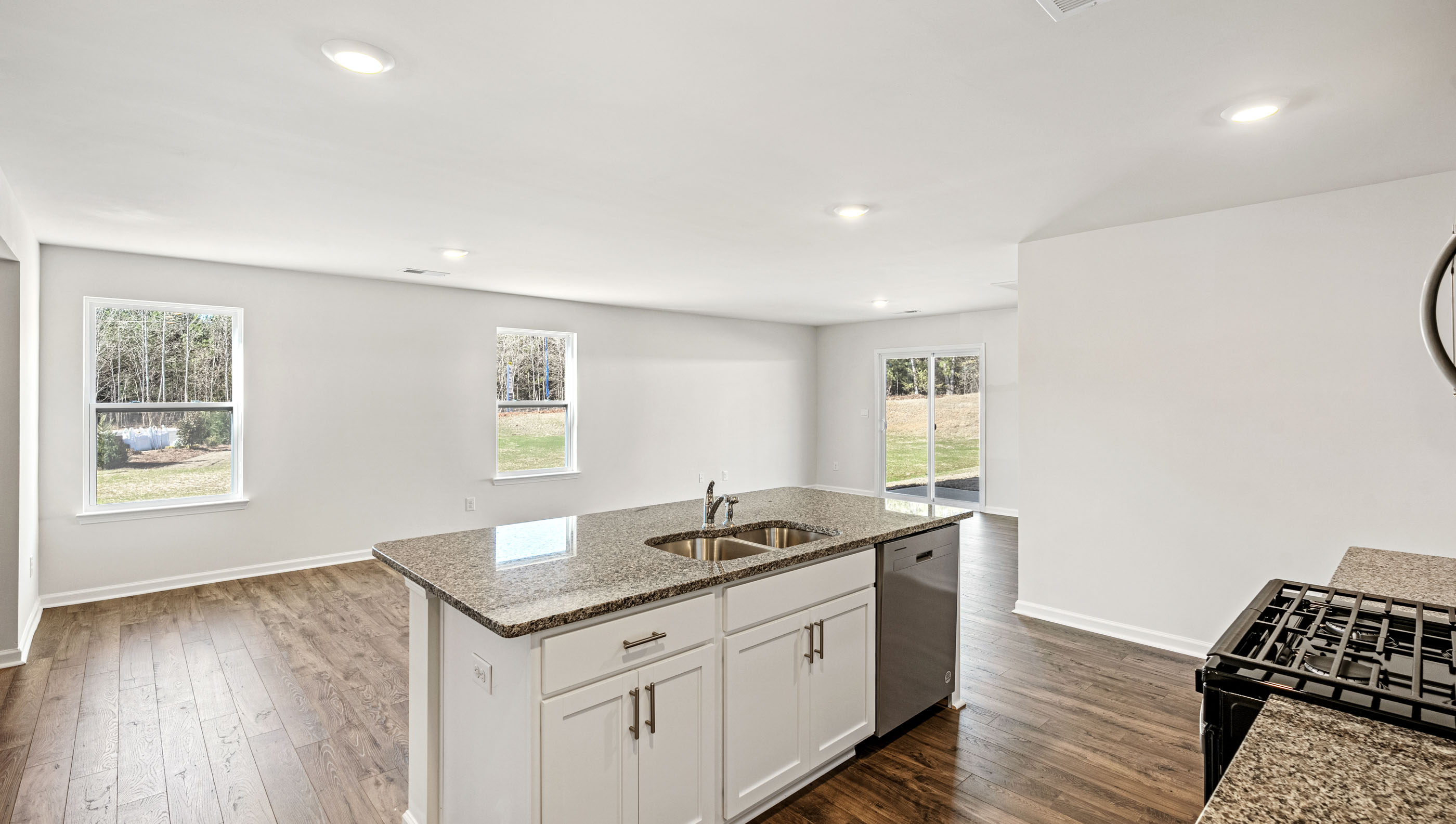 Kitchen with island and granite countertops.