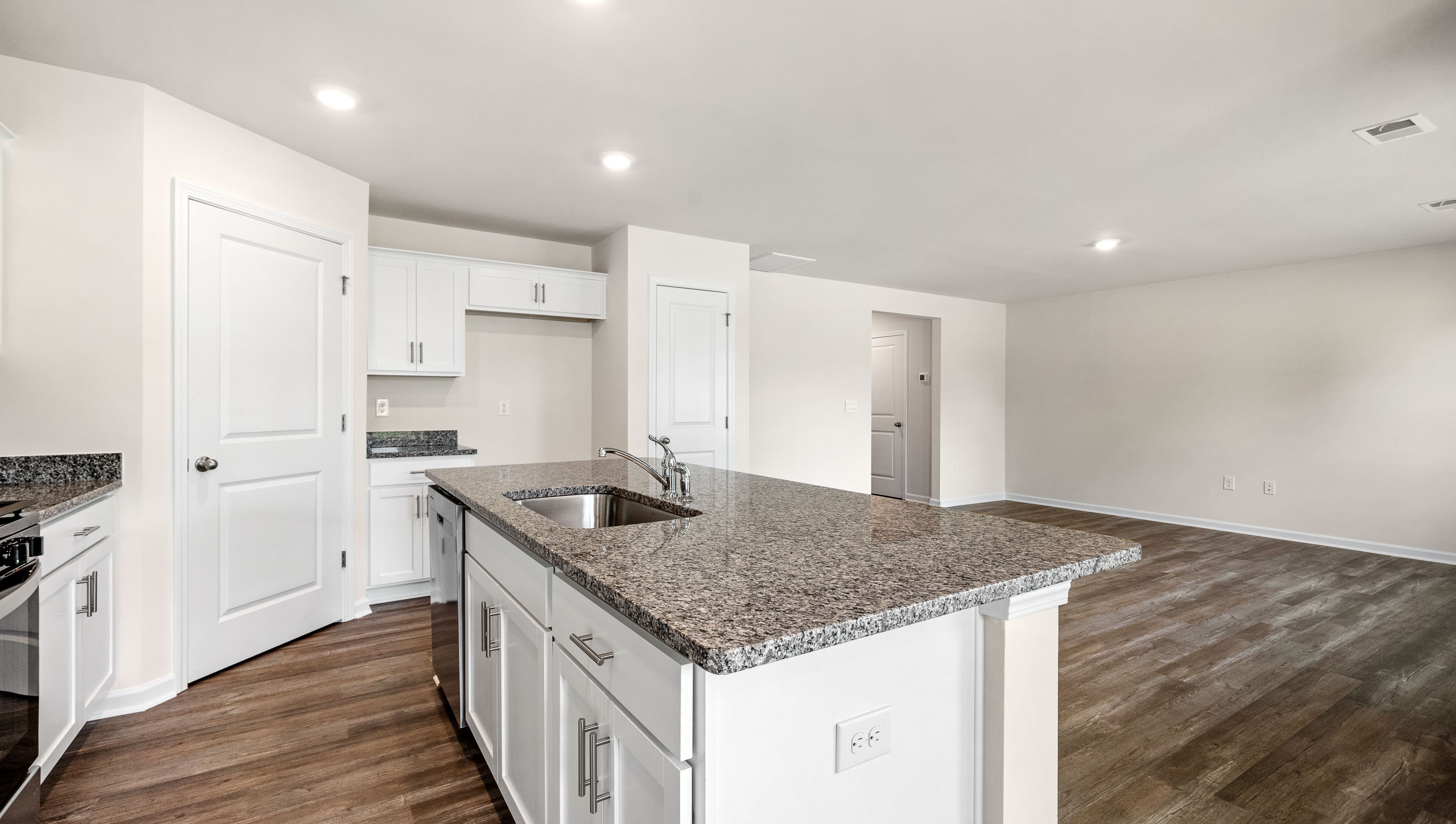 Kitchen with island and countertops.
