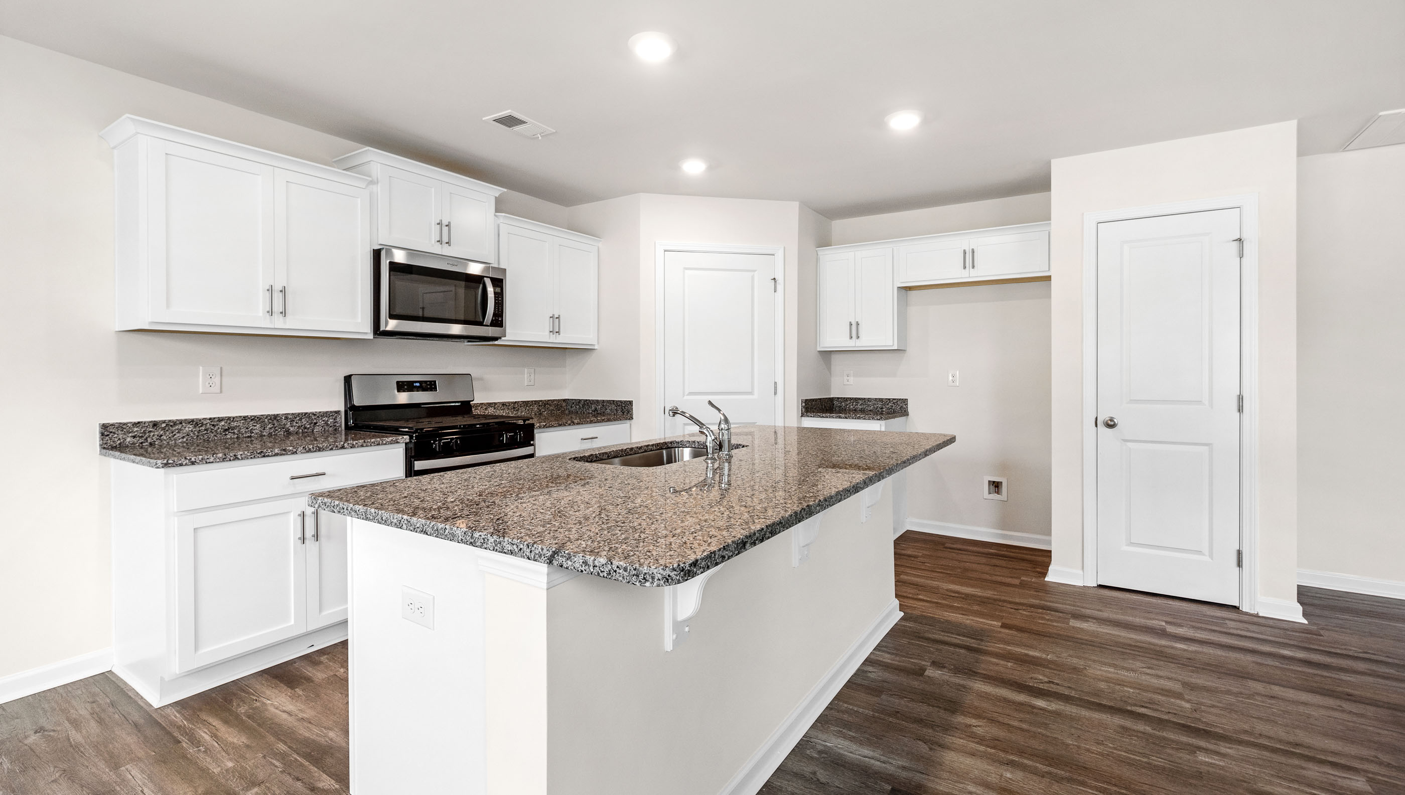 Kitchen with island and countertops.