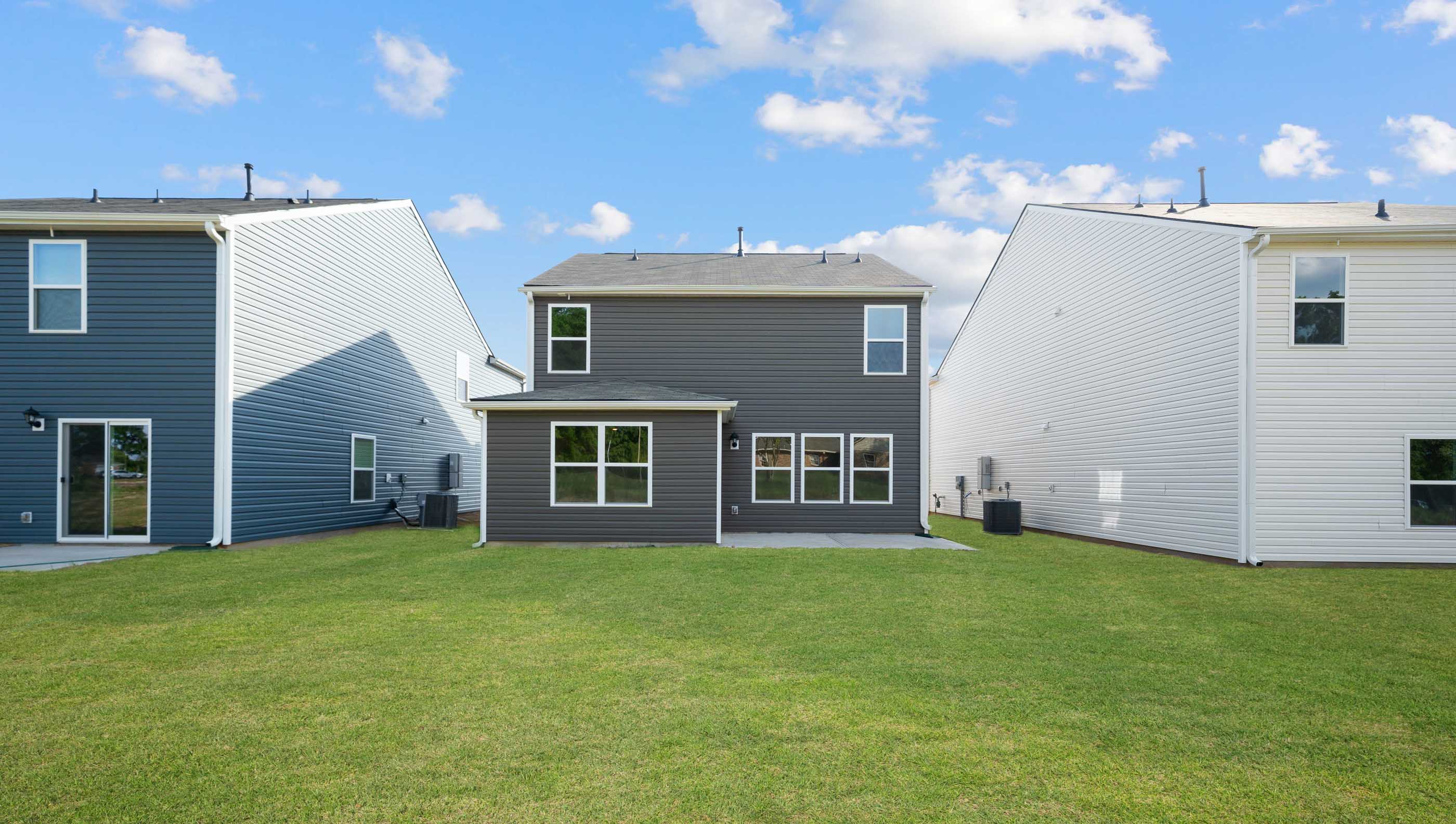 Exterior of home with large backyard.