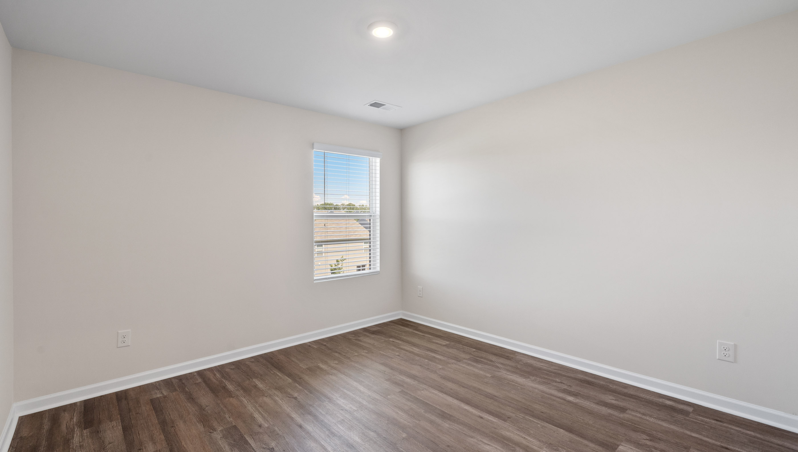 Bedroom 1 with large window.