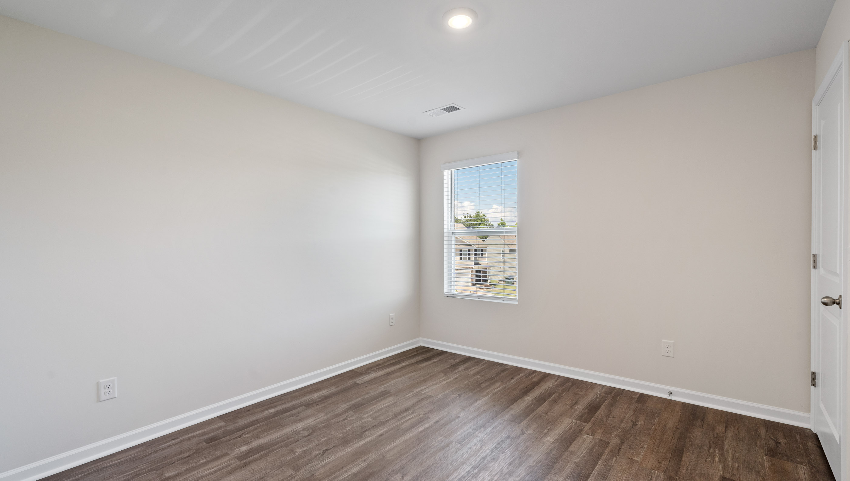Bedroom 2 with large window.
