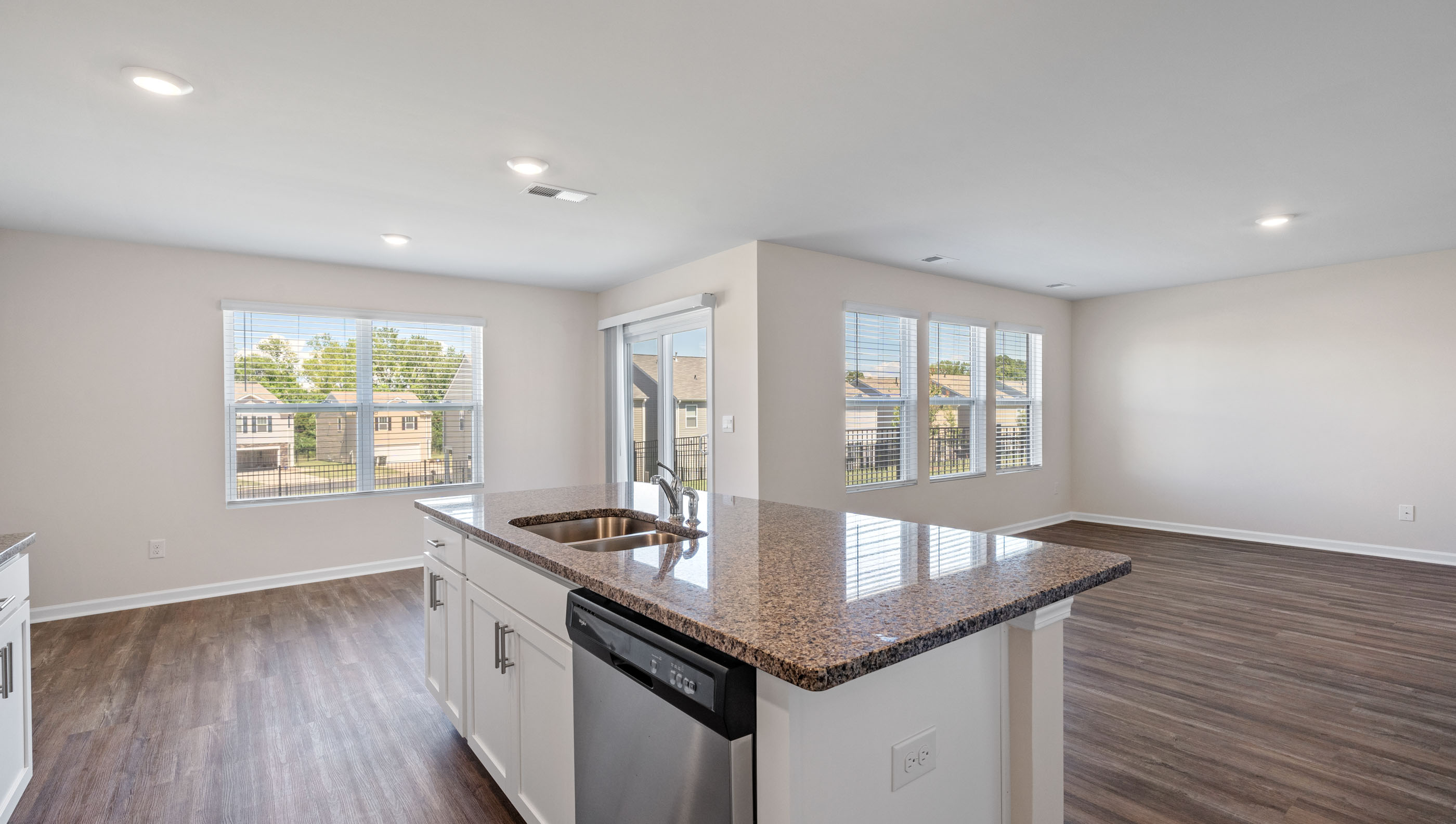 Kitchen and island with granite counter tops.