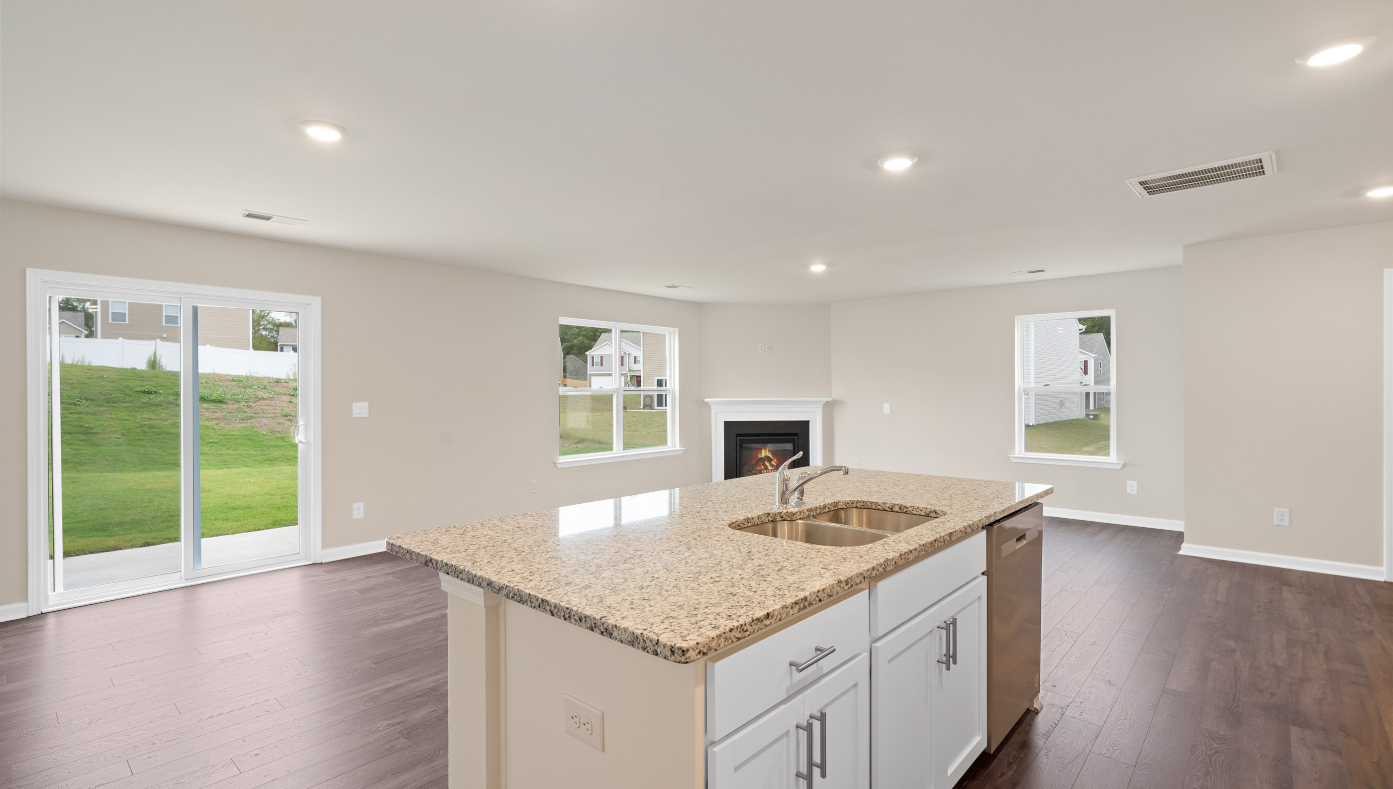 Kitchen and island with granite counter tops.