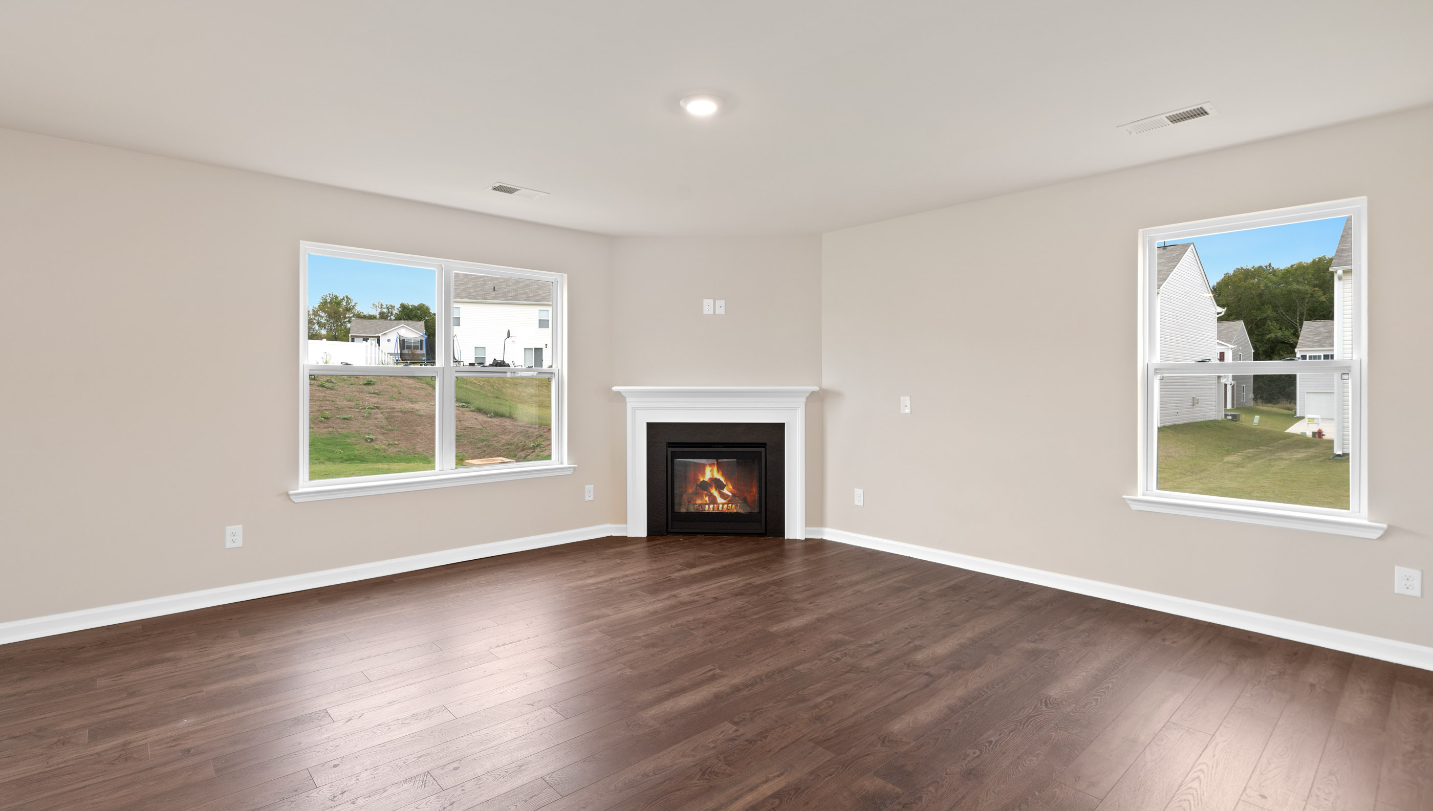 Family room with windows and fireplace.