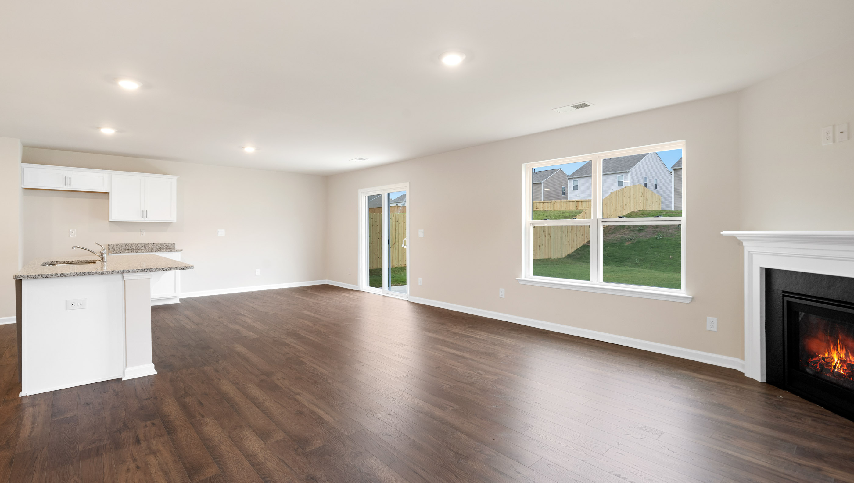 Family room with windows and fireplace.