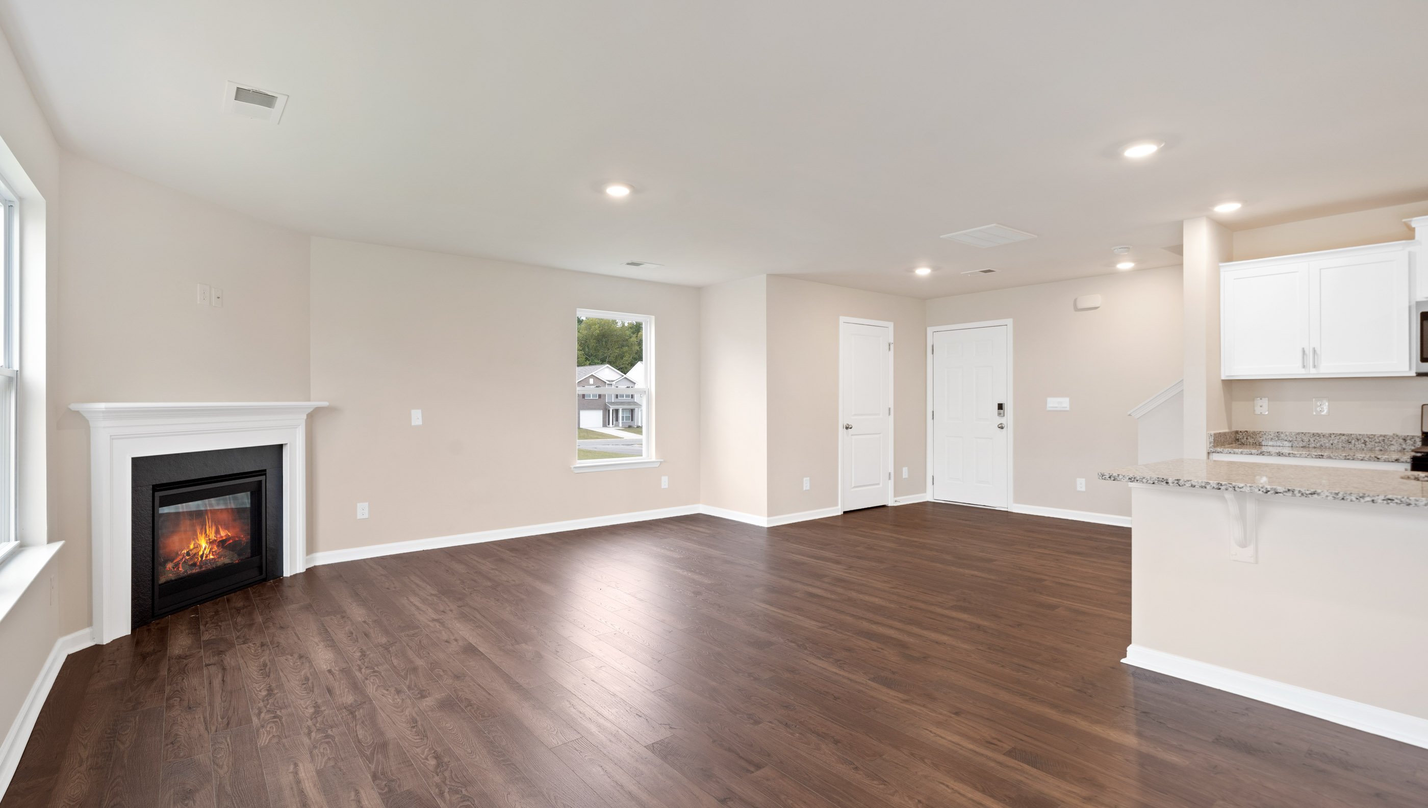 Family room with windows and fireplace.