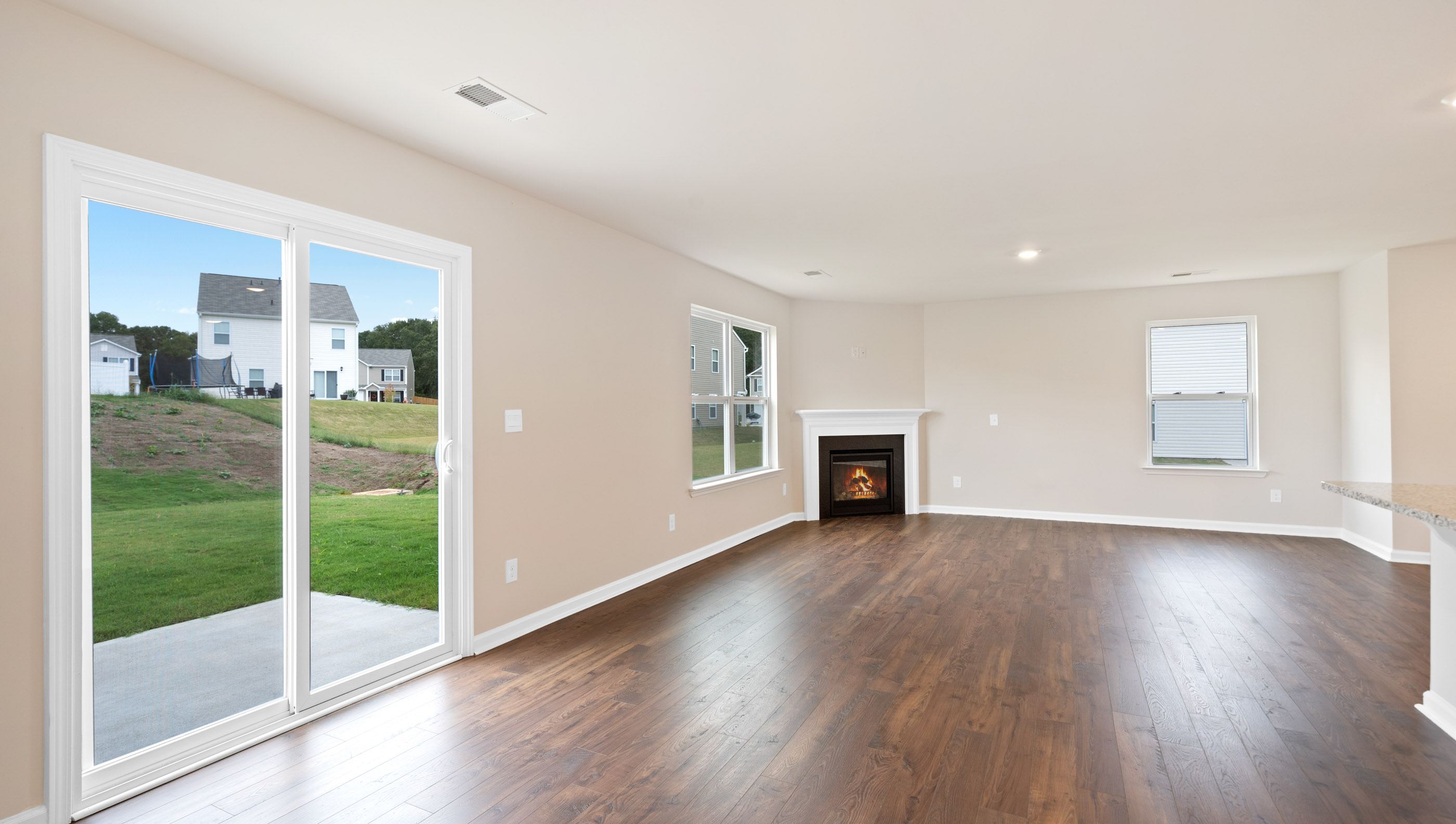 Family room with windows and fireplace.