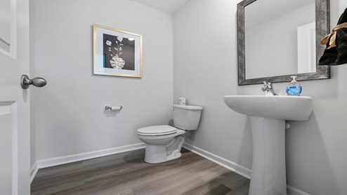 Half bathroom with mirrow.