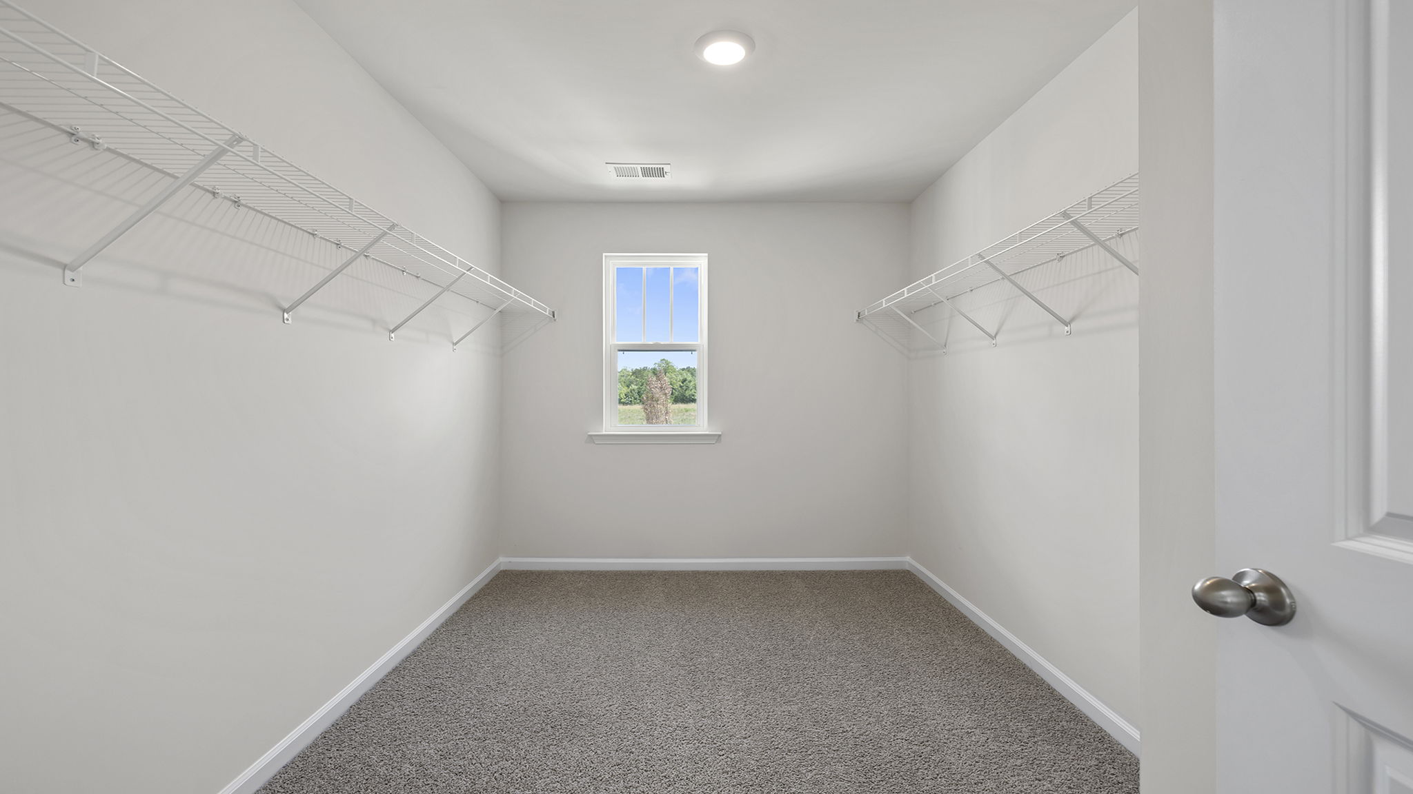 Walk in closet with window.